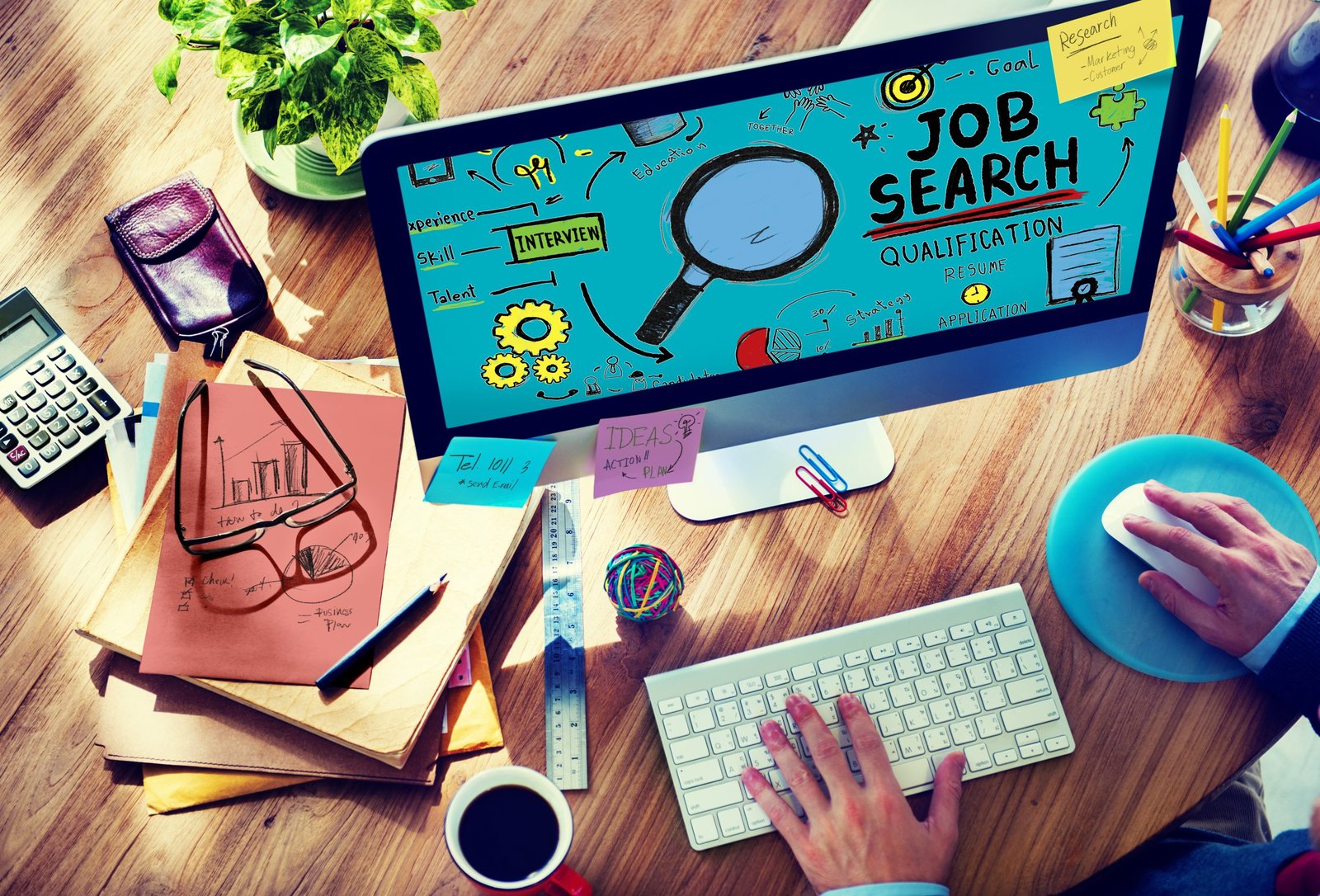 a person typing on a computer searching for a job on Aussie Jobs